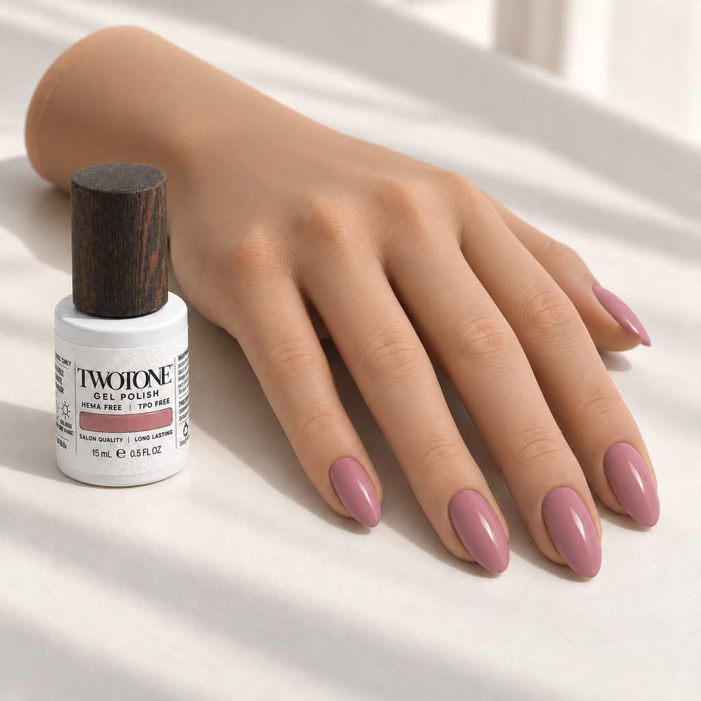 Illustrative Cherry Blossom manicure on a silicone practice hand beside the TWOTONE bottle; color appearance may vary