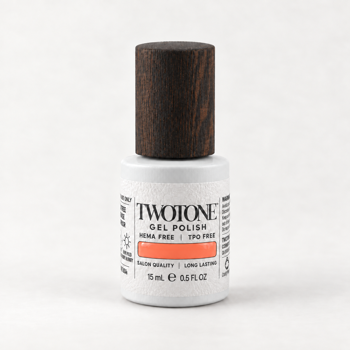 TWOTONE Coral Whisper gel polish, 15 mL, white bottle with dark wooden cap and warm orange coral swatch
