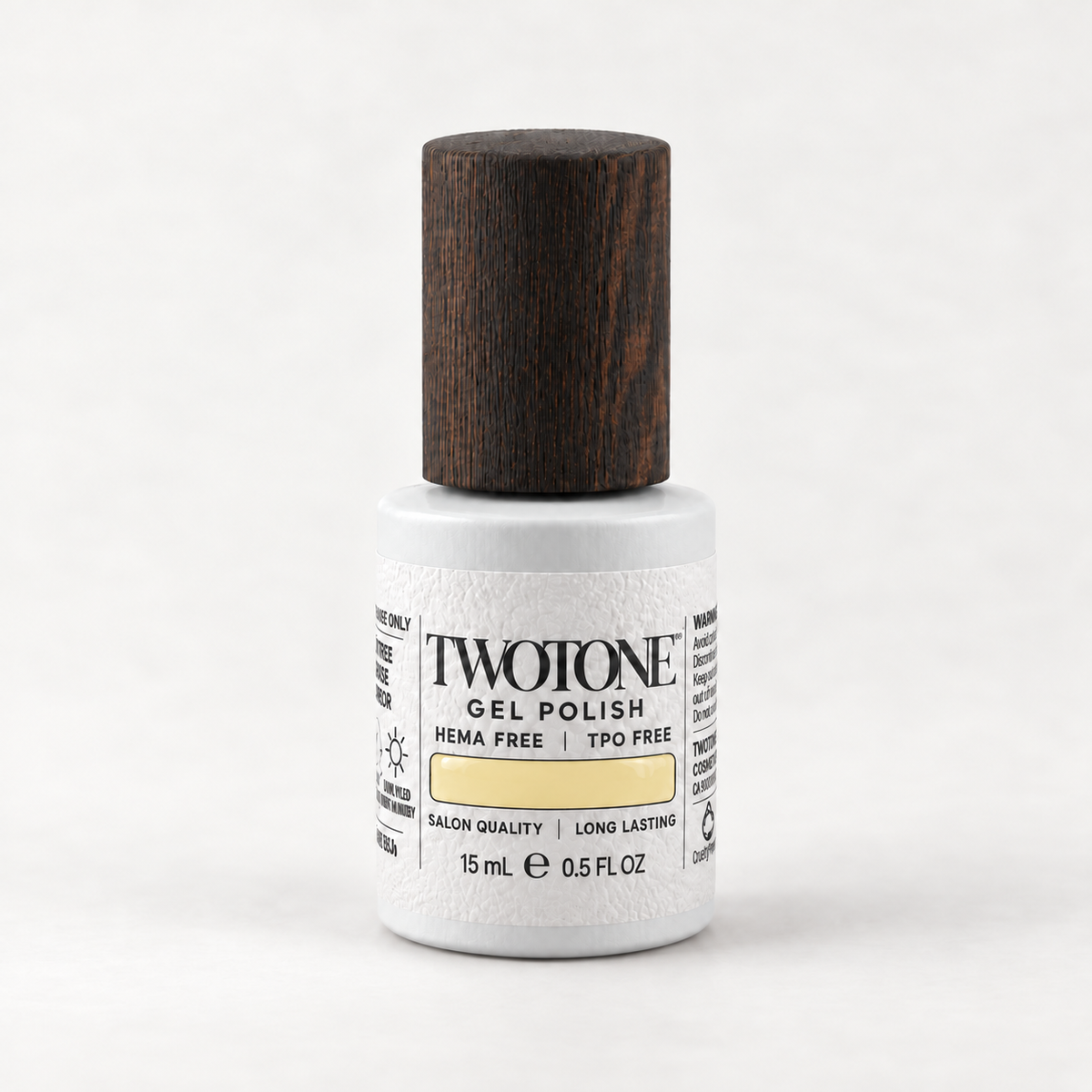 TWOTONE Downy Chick gel polish, 15 mL, white bottle with dark wooden cap and soft muted butter yellow swatch