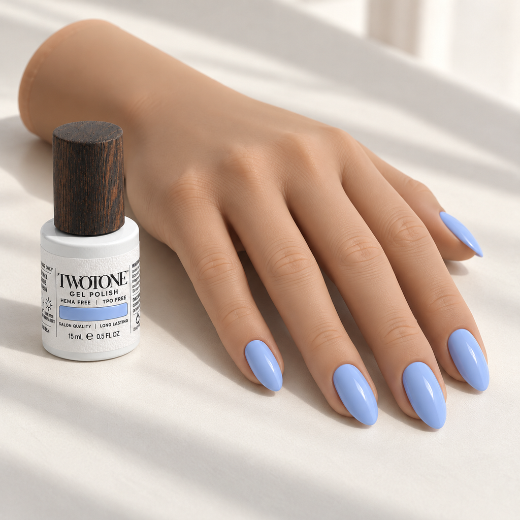 Illustrative Soft Lavender manicure on a silicone practice hand beside the TWOTONE bottle; color appearance may vary